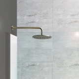 Close up product lifestyle image of the JTP Vos Brushed Brass 250mm Round Shower Head